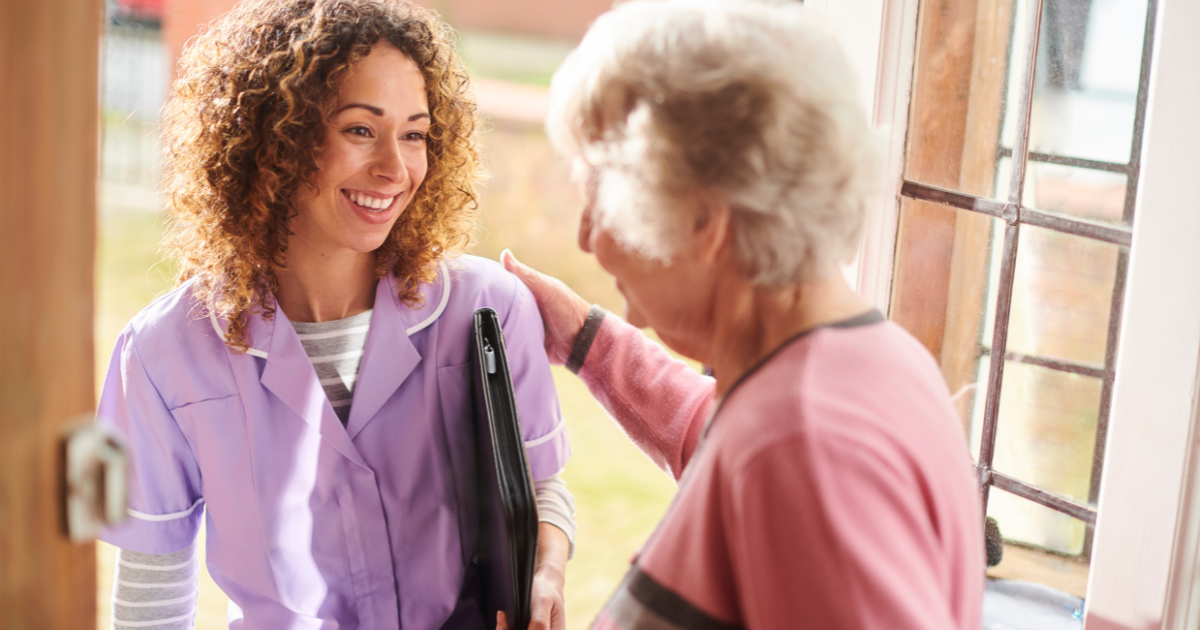 A caregiver enters a senior’s home to provide respite care services