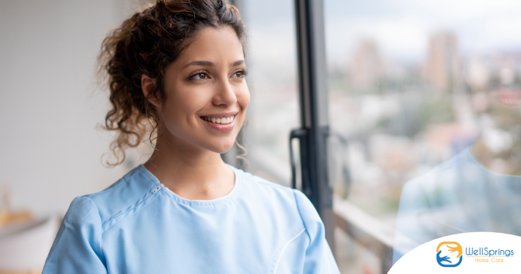 A woman in scrubs smiles, representing the satisfaction that can come with transitioning into a professional caregiving career.